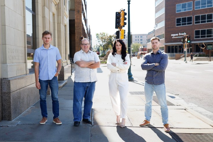 The Jeff Merrill Team standing together in downtown Sioux Falls, South Dakota